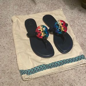 Tory Burch Miller sandals patent leather navy with rainbow emblem.